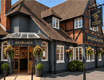 The Spyglass & Kettle pub entrance with hanging baskets